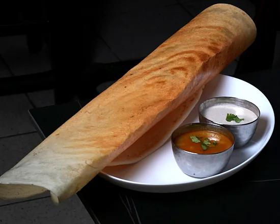 Crisp rolled dosa with sambar and coconut chutney